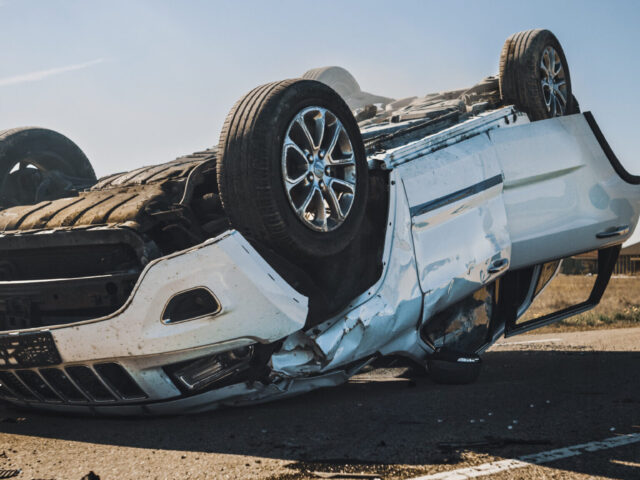 Horrific,Traffic,Accident,,Rollover,Smoking,And,Burning,Vehicle,Lying,On